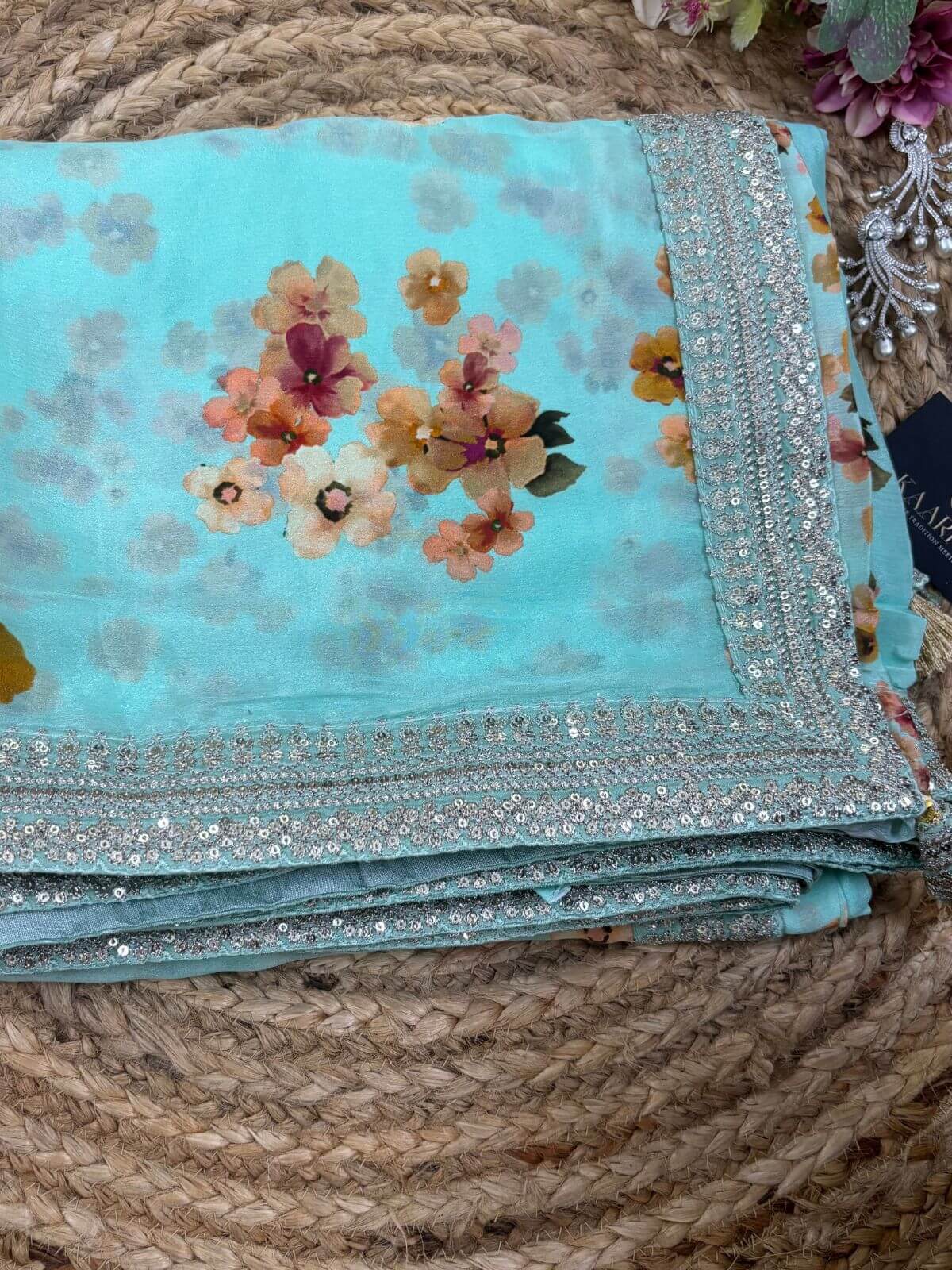 Designer border detail of sea green printed chinon chifon saree